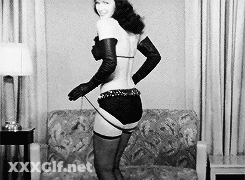 Bettie Page's Vintage Tease: A Sultry, Sensual Experience GIF