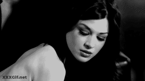 Brunette Babe's Sultry Stare: A Tantalizing Tale GIF