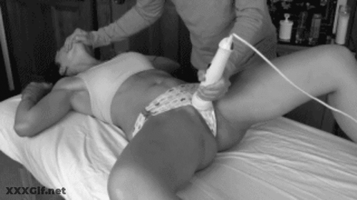 Enticed Orgasm: Vibrator Fun On The Bed GIF