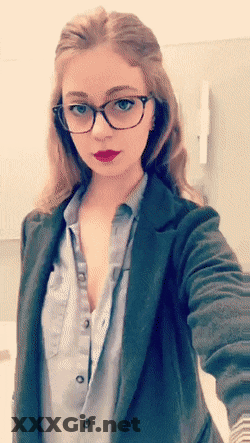 Redhead Flashes Tits In Glasses GIF