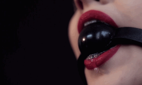 BDSM Drooling Gag: A Sensual Experience With Toys GIF