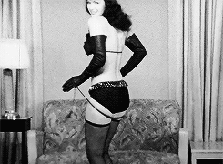 Bettie Page's Vintage Tease: A Sultry, Sensual Experience GIF