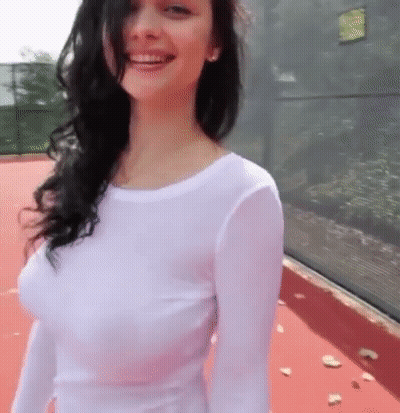 Babes With Big Tits: Brunette Bombshell Smiling For The Camera GIF