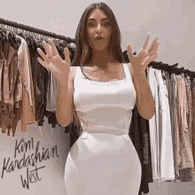 Big Tits Brunette Celebrity Kardashian West Poses In White Dress GIF