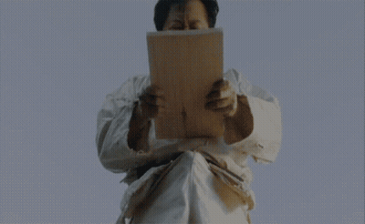 Funny Asian Man Reading Paper GIF