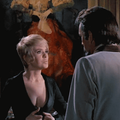 Joey Heatherton's Vintage Striptease: Short Hair, Long Legs, And Sultry Looks GIF