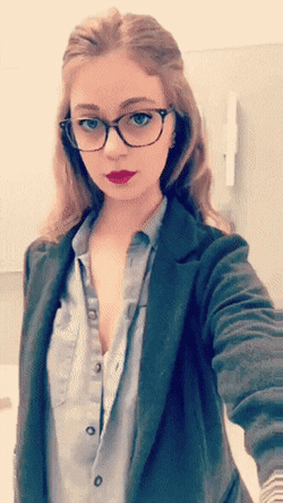Redhead Flashes Tits In Glasses GIF
