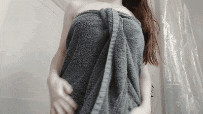 Redhead With Big Tits Shows Off Her Towel GIF