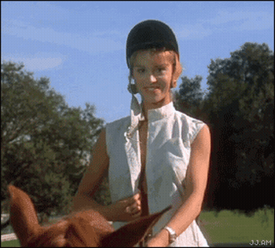 Riding A Horse With Big Tits In A Public Place GIF